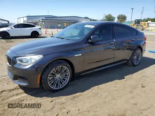 2014 BMW 5 Series GT 535i with VIN WBA5M2C55ED871907, listed as a Copart auction lot 73001564 with 90,576 mi miles and Salvage Title. Bid and sale history available at carsss.com. Image 1.