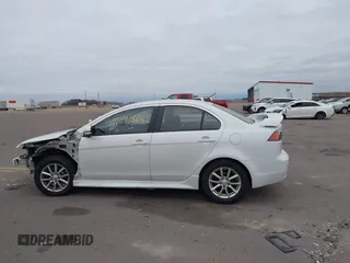 2016 Mitsubishi Lancer SE with VIN JA32V2FWXGU003619, listed as a IAAI auction lot 41041665 with 98,627 mi miles. Bid and sale history available at carsss.com. Image 14.