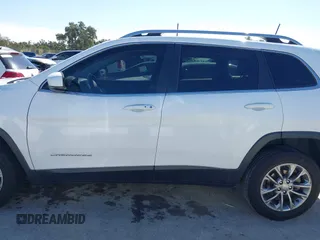 2019 Jeep Cherokee Latitude Plus with VIN 1C4PJLLNXKD290098, listed as a IAAI auction lot 40840063 with 202,244 mi miles and . Bid and sale history available at DreamBid. Image 14.