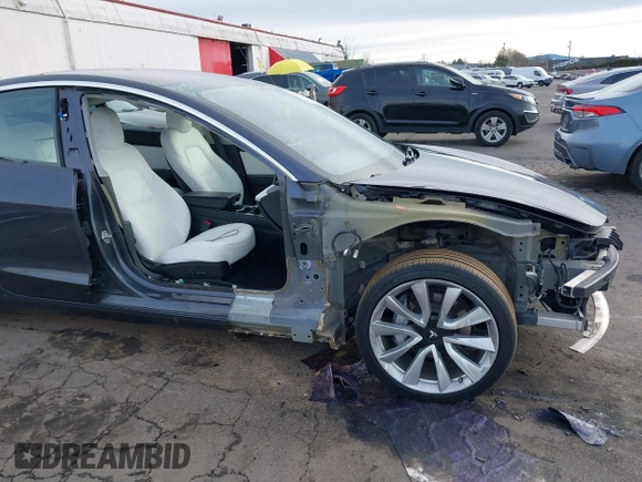 2018 Tesla Model 3 Long Range Battery with VIN 5YJ3E1EB9JF097118, listed as a IAAI auction lot 41619510 with 64,132 mi miles and . Bid and sale history available at DreamBid. Image 6.