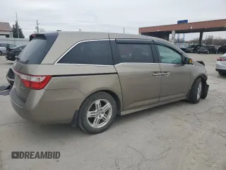 2012 Honda Odyssey Touring with VIN 5FNRL5H9XCB078399, listed as a Copart auction lot 52360165 with 174,819 mi miles and Salvage Title. Bid and sale history available at DreamBid. Image 3.
