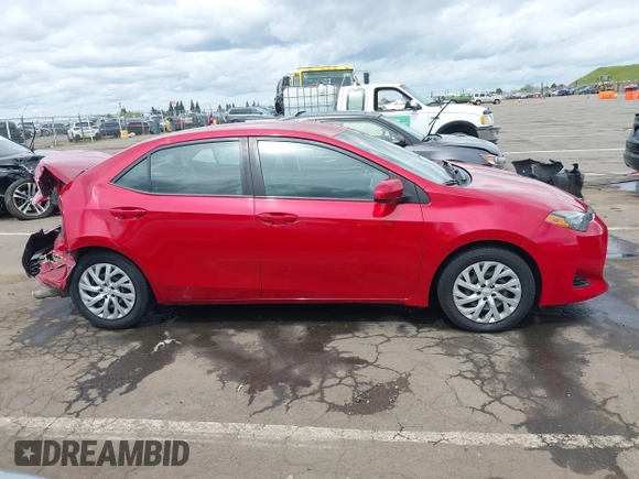2019 Toyota Corolla L with VIN 5YFBURHE4KP883871, listed as a IAAI auction lot 41979494 with 179,078 mi miles. Bid and sale history available at carsss.com. Image 13.
