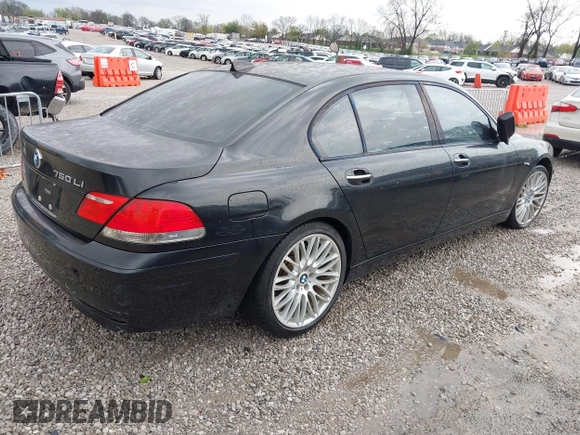2007 BMW 7 Series 750Li with VIN WBAHN83577DT77290, listed as a IAAI auction lot 41908957 with 164,215 mi miles. Bid and sale history available at carsss.com. Image 4.