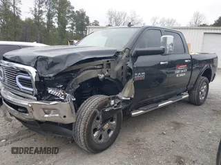 2016 Ram 2500 Laramie with VIN 3C6UR5FL3GG387758, listed as a IAAI auction lot 41522575 with 322,434 mi miles. Bid and sale history available at carsss.com. Image 2.