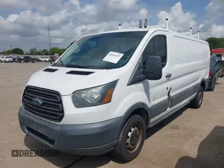 2015 Ford Transit Cargo with VIN 1FTYR2ZM2FKA86869, listed as a IAAI auction lot 42635477 with 14,695 mi miles and . Bid and sale history available at DreamBid. Image 2.