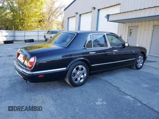 2001 Bentley Arnage with VIN SCBLC31E21CX05644, listed as a Copart auction lot 77706154 with 57,446 mi miles and Clean Title. Bid and sale history available at DreamBid. Image 3.