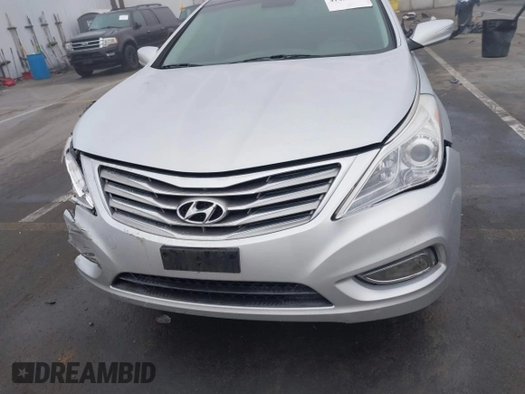 2014 Hyundai Azera Limited with VIN KMHFH4JG7EA388931, listed as a IAAI auction lot 41468407 with 130,597 mi miles and . Bid and sale history available at DreamBid. Image 12.