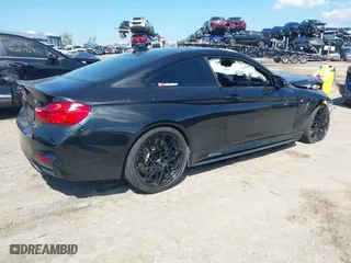 2016 BMW M4 with VIN WBS3R9C51GK708621, listed as a IAAI auction lot 41678133 with 59,501 mi miles. Bid and sale history available at carsss.com. Image 4.
