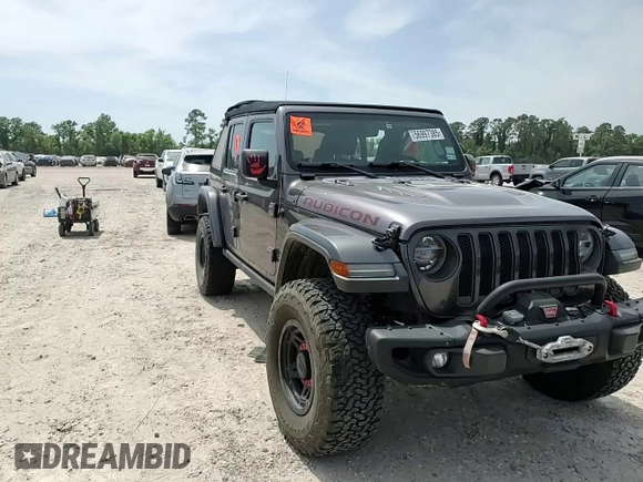 2018 Jeep Wrangler Unlimited Rubicon with VIN 1C4HJXFG6JW166731, listed as a Copart auction lot 56997385 with 117,713 mi miles and Salvage title. Bid and sale history available at DreamBid. Image 12.