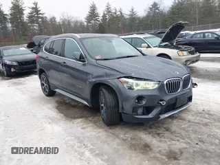 2016 BMW X1 xDrive28i with VIN WBXHT3C34GP880738, listed as a IAAI auction lot 41398105 with 113,445 mi miles. Bid and sale history available at carsss.com. Image 1.