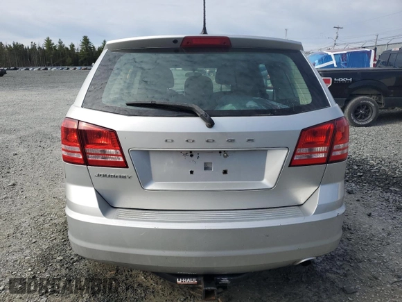 2013 Dodge Journey American Value z VIN 3C4PDCABXDT621551, wystawiony jako Copart lot #52523675 z przebiegiem 123 348 mil mil oraz Szkoda całkowita • Salvage title. Historia ofert i sprzedaży dostępna na DreamBid. Obrazek 6.