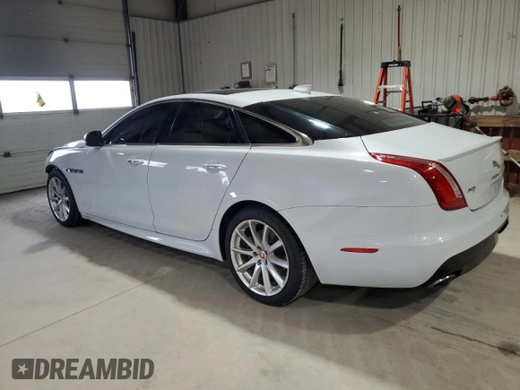 2016 Jaguar XJ R-Sport with VIN SAJWJ1CDXG8W00145, listed as a Copart auction lot 49901234 with 76,629 mi miles and . Bid and sale history available at DreamBid. Image 2.