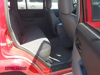 1998 Jeep Cherokee Sport with VIN 1J4FT68S2WL256846, listed as a IAAI auction lot 41998490 with 198,936 mi miles. Bid and sale history available at carsss.com. Image 8.