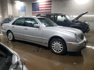 2000 Mercedes-Benz E-Class with VIN WDBJF82J1YX030388, listed as a Copart auction lot 86384974 with 212,596 mi miles and Salvage Title. Bid and sale history available at carsss.com. Image 4.