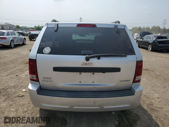 2005 Jeep Grand Cherokee Laredo z VIN 1J4GR48KX5C581833, wystawiony jako Copart lot #60975355 z przebiegiem 149 993 mil mil oraz Szkoda całkowita • Salvage title. Historia ofert i sprzedaży dostępna na DreamBid. Obrazek 6.