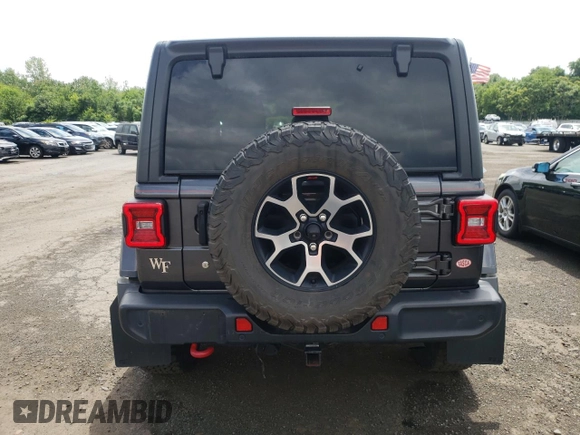 2018 Jeep Wrangler Unlimited Rubicon with VIN 1C4HJXFG1JW261472, listed as a Copart auction lot 63259345 with 60,457 mi miles and Salvage title. Bid and sale history available at DreamBid. Image 6.