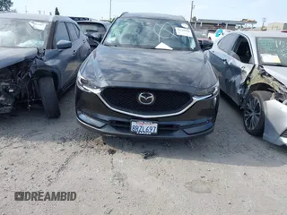 2020 Mazda CX-5 Grand Touring with VIN JM3KFADM3L1819939, listed as a IAAI auction lot 42749920 with 35,407 mi miles and . Bid and sale history available at DreamBid. Image 13.