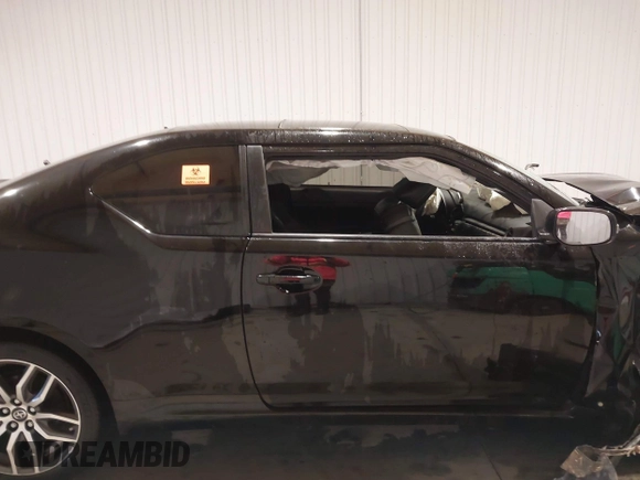 2014 Scion tC z VIN JTKJF5C74E3086243, wystawiony jako IAAI lot #40983287 z przebiegiem Nie podano mil oraz . Historia ofert i sprzedaży dostępna na DreamBid. Obrazek 14.