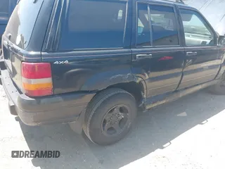 1997 Jeep Grand Cherokee Laredo with VIN 1J4GZ58S3VC508194, listed as a IAAI auction lot 42578622 with 146,559 mi miles and . Bid and sale history available at DreamBid. Image 4.