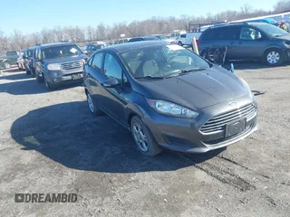 2015 Ford Fiesta SE z VIN 3FADP4BJ5FM219915, wystawiony jako IAAI lot #41725718 z przebiegiem 153 136 mil mil oraz . Historia ofert i sprzedaży dostępna na DreamBid. Obrazek 1.