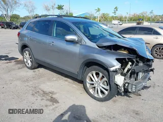 2015 Mazda CX-9 Sport with VIN JM3TB2BA1F0467162, listed as a IAAI auction lot 41565602 with 127,957 mi miles and . Bid and sale history available at carsss.com. Image 1.