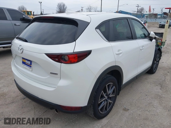 2018 Mazda CX-5 Touring z VIN JM3KFBCM6J0323107, wystawiony jako IAAI lot #41895519 z przebiegiem 86 124 mil mil oraz . Historia ofert i sprzedaży dostępna na DreamBid. Obrazek 4.