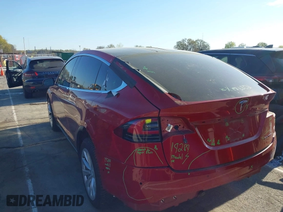 2020 Tesla Model X Long Range with VIN 5YJXCDE22LF217014, listed as a IAAI auction lot 41845824 with 149,375 mi miles and . Bid and sale history available at DreamBid. Image 3.