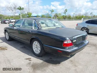 2000 Jaguar XJ with VIN SAJDA14C1YLF04600, listed as a IAAI auction lot 41496106 with 105,000 mi miles. Bid and sale history available at carsss.com. Image 3.