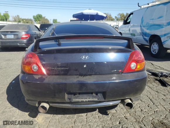 2004 Hyundai Tiburon GT with VIN KMHHN65FX4U108253, listed as a Copart auction lot 77635034 with 34,170 mi miles and Salvage Title. Bid and sale history available at carsss.com. Image 6.