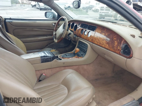 1997 Jaguar XK with VIN SAJGX2745VC017589, listed as a IAAI auction lot 42208129 with Not Provided miles and . Bid and sale history available at DreamBid. Image 5.