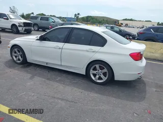 2013 BMW 3 Series 328i with VIN WBA3A5G51DNP26142, listed as a IAAI auction lot 41767977 with 129,440 mi miles. Bid and sale history available at carsss.com. Image 3.
