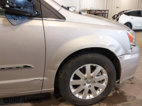 2014 Chrysler Town & Country Touring with VIN 2C4RC1BG2ER422914, listed as a IAAI auction lot 42017742 with 49,856 mi miles and . Bid and sale history available at DreamBid. Image 6.
