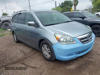 2005 Honda Odyssey EX with VIN 5FNRL38415B104920, listed as a IAAI auction lot 42094690 with 228,538 mi miles. Bid and sale history available at carsss.com. Image 1.
