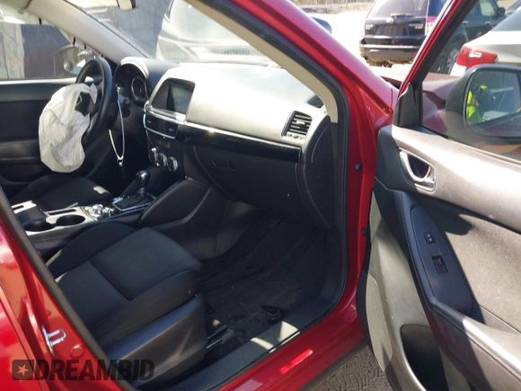 2016 Mazda CX-5 Sport with VIN JM3KE4BY7G0805631, listed as a IAAI auction lot 42028606 with 93,659 mi miles and . Bid and sale history available at carsss.com. Image 5.