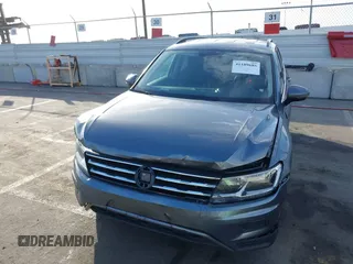 2021 Volkswagen Tiguan SE with VIN 3VV3B7AX8MM071303, listed as a IAAI auction lot 41109686 with 40,684 mi miles and . Bid and sale history available at DreamBid. Image 6.