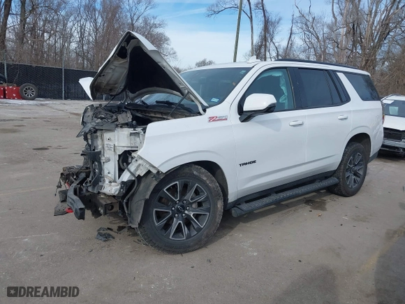 2021 Chevrolet Tahoe Z71 with VIN 1GNSKPKDXMR318664, listed as a IAAI auction lot 41382037 with 136,125 mi miles. Bid and sale history available at carsss.com. Image 2.
