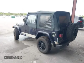 1999 Jeep Wrangler Sport with VIN 1J4FY19S1XP402974, listed as a IAAI auction lot 41659511 with 152,024 mi miles. Bid and sale history available at carsss.com. Image 3.