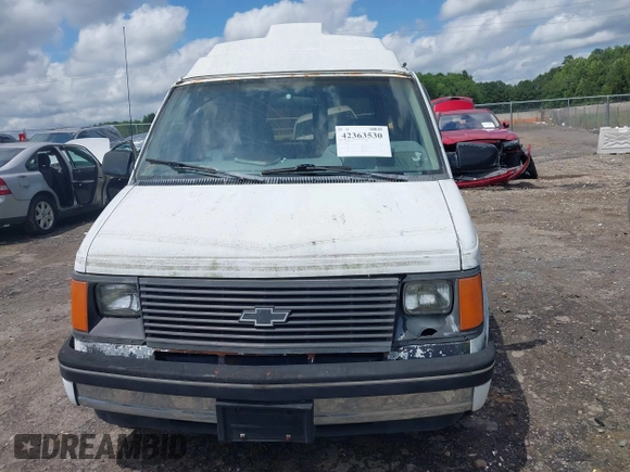 1991 Chevrolet Astro Cargo z VIN 1GBDM19Z7MB202913, wystawiony jako IAAI lot #42363530 z przebiegiem 191 695 mil mil oraz . Historia ofert i sprzedaży dostępna na DreamBid. Obrazek 12.