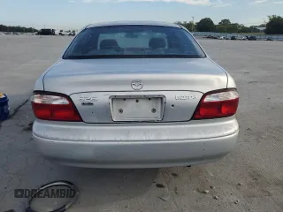 2000 Mazda 626 LX with VIN 1YVGF22C3Y5126135, listed as a Copart auction lot 70650264 with 154,517 mi miles and Salvage Title. Bid and sale history available at carsss.com. Image 6.