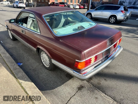 1986 Mercedes-Benz 560 with VIN WDBCA45D2GA206016, listed as a Copart auction lot 54577205 with 205,332 mi miles and Clean Title. Bid and sale history available at DreamBid. Image 3.