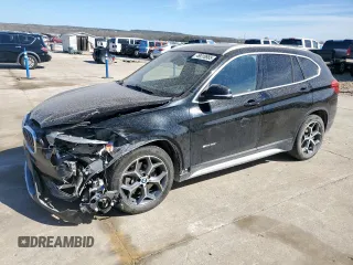 2018 BMW X1 sDrive28i with VIN WBXHU7C31J5H39068, listed as a Copart auction lot 49018985 with 100,611 mi miles and Salvage Title. Bid and sale history available at carsss.com. Image 1.