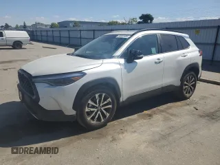 2025 Toyota Corolla Cross XLE with VIN 7MUDAABG4SV123031, listed as a Copart auction lot 56951885 with 5,828 mi miles and Salvage title. Bid and sale history available at DreamBid. Image 1.