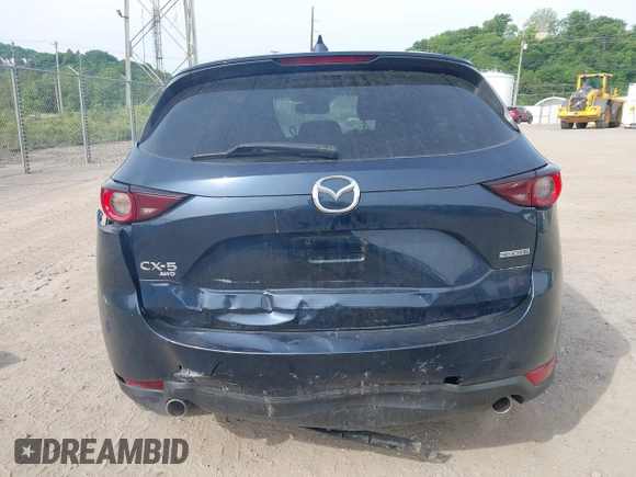 2021 Mazda CX-5 Touring z VIN JM3KFBCMXM0389857, wystawiony jako IAAI lot #42309650 z przebiegiem 49 938 mil mil oraz . Historia ofert i sprzedaży dostępna na DreamBid. Obrazek 16.