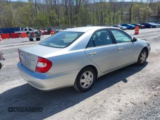 2004 Toyota Camry LE with VIN 4T1BE30K14U290983, listed as a IAAI auction lot 41983078 with 174,852 mi miles and . Bid and sale history available at carsss.com. Image 4.