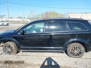 2018 Dodge Journey SE z VIN 3C4PDCAB9JT243816, wystawiony jako IAAI lot #41982817 z przebiegiem 173 092 mil mil oraz . Historia ofert i sprzedaży dostępna na DreamBid. Obrazek 13.