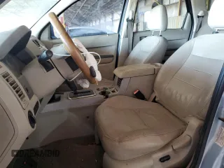 2008 Ford Escape Hybrid with VIN 1FMCU49H98KA28845, listed as a Copart auction lot 52648135 with 210,756 mi miles and Salvage title. Bid and sale history available at DreamBid. Image 7.