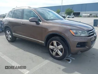 2011 Volkswagen Touareg Sport with VIN WVGFF9BP2BD007322, listed as a IAAI auction lot 41699911 with 233,433 mi miles and . Bid and sale history available at DreamBid. Image 1.