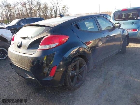 2015 Hyundai Veloster with VIN KMHTC6AD0FU245001, listed as a IAAI auction lot 41881391 with 119,873 mi miles. Bid and sale history available at carsss.com. Image 4.
