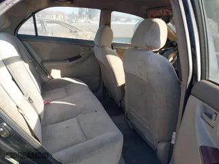 2003 Toyota Corolla CE with VIN 1NXBR32E43Z047677, listed as a IAAI auction lot 41427393 with 299,999 mi miles. Bid and sale history available at carsss.com. Image 8.