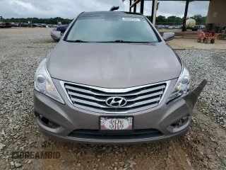 2013 Hyundai Azera z VIN KMHFH4JG4DA262993, wystawiony jako Copart lot #58497925 z przebiegiem 151 568 mil mil oraz Szkoda całkowita • Salvage title. Historia ofert i sprzedaży dostępna na DreamBid. Obrazek 5.